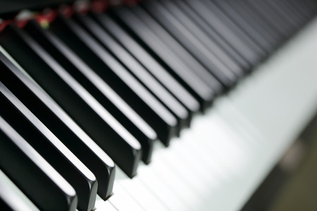 Close up view of piano key forming backgroundの写真素材