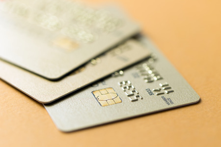 Close up of credit cards over orange backgroundの写真素材