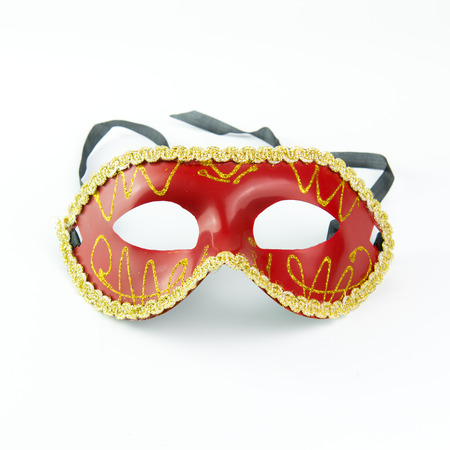 Red party masquerade mask isolated on white backgroundの写真素材