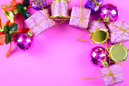 Christmas ornaments on purple background, with copy spaceの写真素材