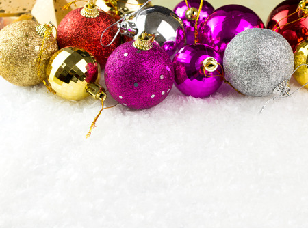 Multicolor Christmas baubles on white background, with copy spaceの写真素材