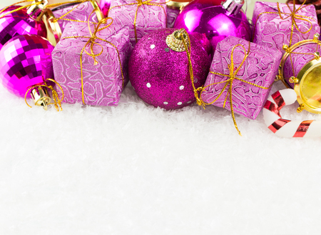 Purple Christmas ornaments on white background, with copy spaceの写真素材