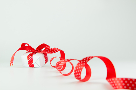 Gifts wrapped with red ribbon and bow, with copy spaceの写真素材