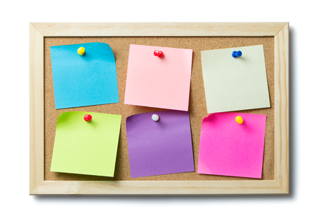 Multicolor blank post it notes on a cork notice boardの写真素材