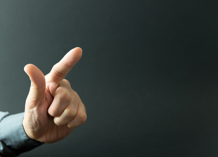 Male index finger is pressing or pointing upの写真素材