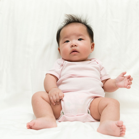 Portrait of Asian baby girl on white backgroundの写真素材