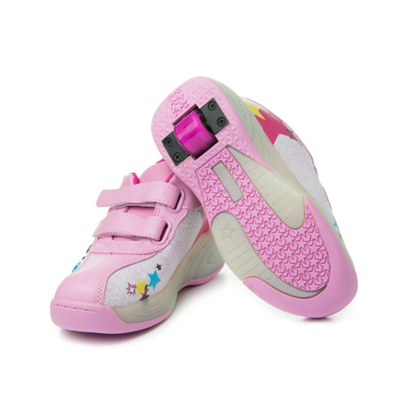 Pair of pink heelys on white backgroundの写真素材