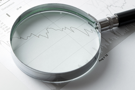 Stock market analysis with a magnifying glassの写真素材