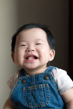 Portrait of healthy little Asian child indoorの写真素材