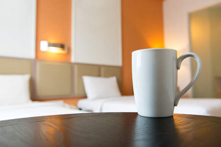 Close up of coffee mug in hotel bedroomの写真素材