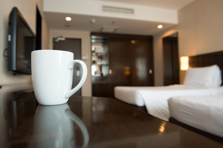 Close up of coffee mug in hotel bedroomの写真素材