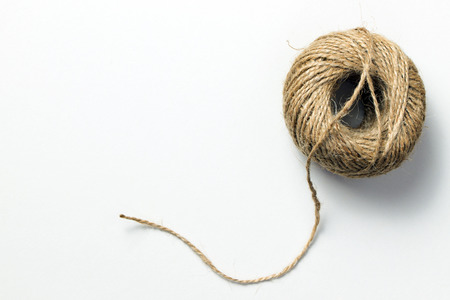 Skein of hemp rope isolated on whiteの写真素材