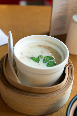 Close up of Thai coconut milk tomyam soup, garnish with parsleyの写真素材