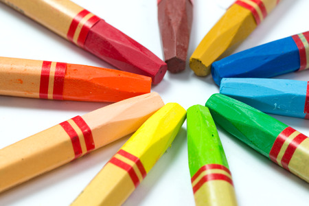 Row of colorful crayon isolated on white backgroundの写真素材