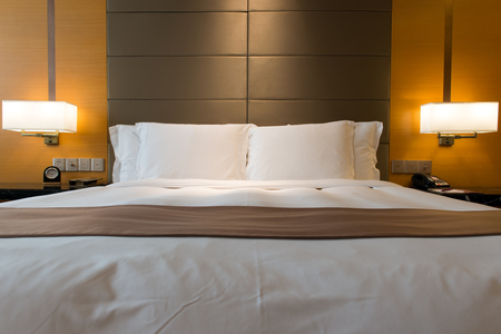 Interior of hotel bedroom with double size bedの写真素材