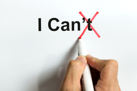 Red marker pen crossing the letter t of the word I can't to reveal I canの写真素材