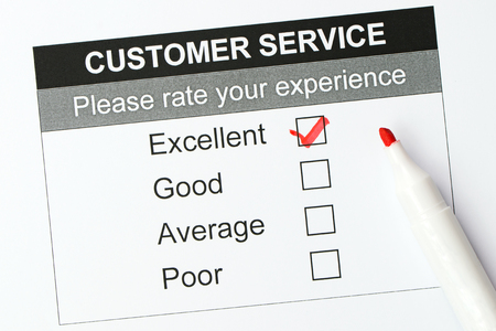 Tick placed in excellent checkbox on customer service satisfaction survey formの写真素材