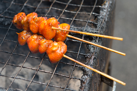 Grilled chicken buttock on street in Malaysiaの写真素材