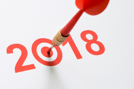 Red dart hit on target with 2018 textの写真素材