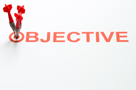 Red dart hit on target with objective textの写真素材