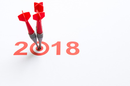 Red dart hit on target with 2018 textの写真素材