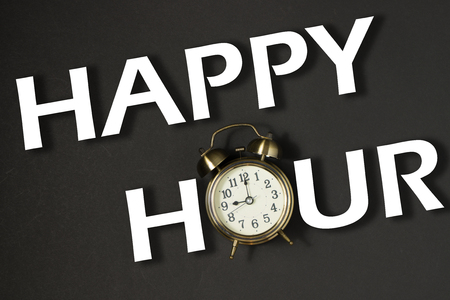 Business concept words happy hour with black classic clockの写真素材