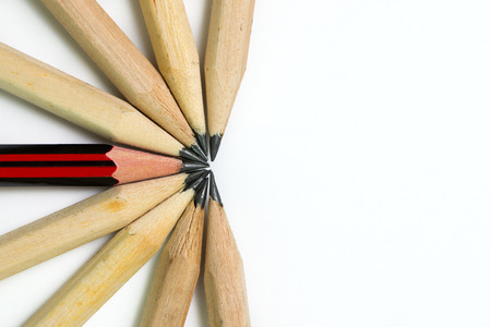 One red pencil standing out from other pencils for outstanding, unique or success concept