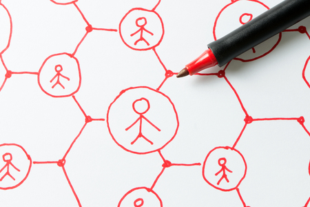 Social media network or people communication diagram drawn on paper using red color penの写真素材
