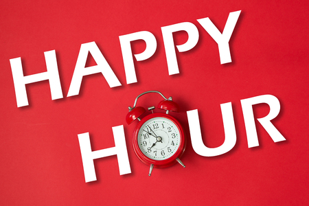 Business concept words happy hour with red classic clockの写真素材