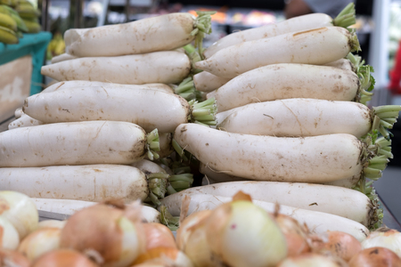 White daikon radishes in the Asian marketの写真素材