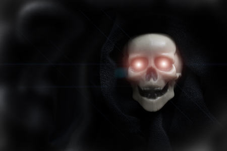 Scary grunge skulls isolated in dark background for halloween designの写真素材