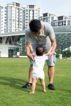 Asian father and son are enjoying beautiful summer outdoorの写真素材