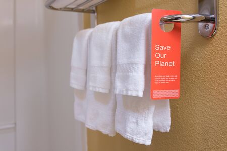 Save water sign label on hotel encourage guest reuse bath towelの写真素材