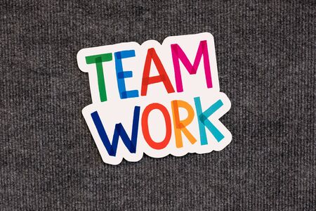 Colorful team work alphabet words on blackboard