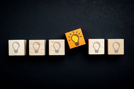 Innovation, creative or new idea concept using wood blocks with lightbulbの写真素材