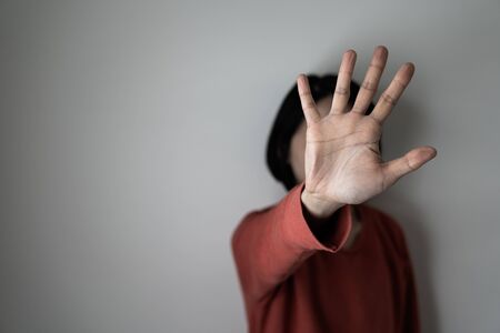 Young woman showing her denial, or saying NO with her hand