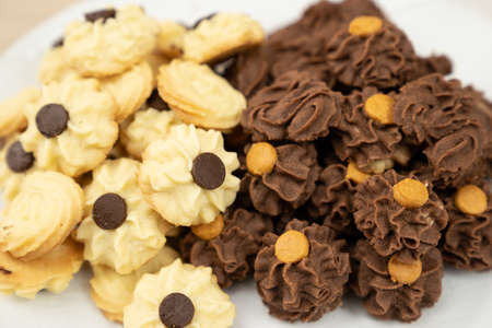 Homemade assorted chocolate bite size butter cookiesの写真素材