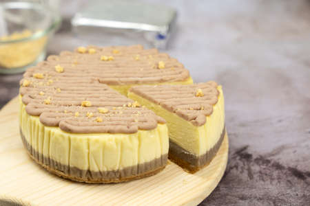 Homemade taro or yam cheese cake on wooden boardの写真素材