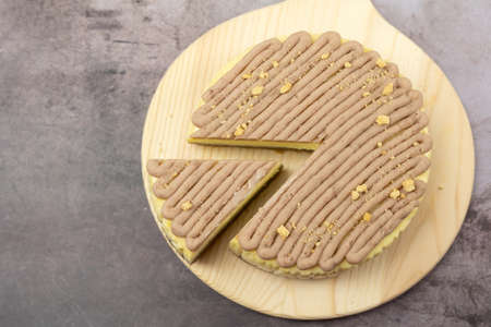 Homemade taro or yam cheese cake on wooden board