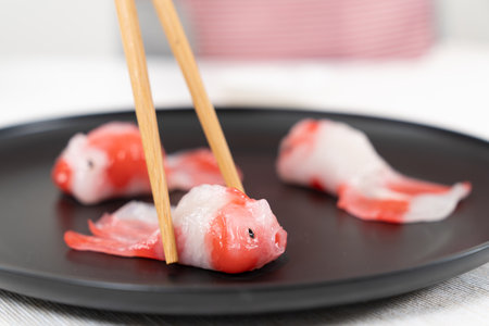 Beautiful steamed crystal dumpling in Koi fish shape, Chinese and Japanese food artの写真素材