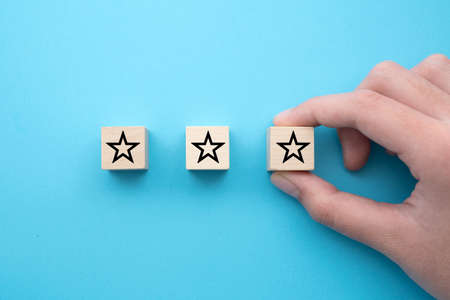 Customer experience, satisfaction survey, and evaluation with excellent three stars rating.の写真素材
