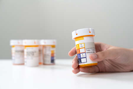 Orange pill bottle concept for healthcare and medicineの写真素材