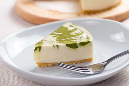 Slice of no bake matcha green tea cheesecakeの写真素材