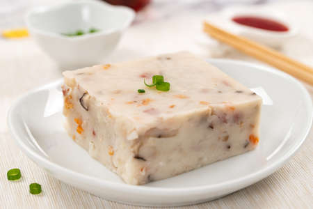 Steamed chinese radish cake, turnip cake or daikon cake ready to be servedの写真素材