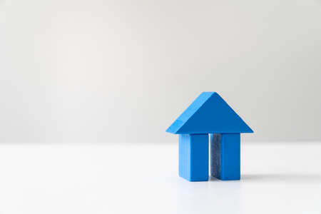 Blue house wood block on white background for real estate property industryの写真素材