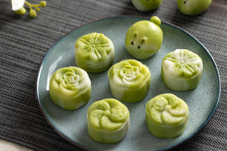 Traditional Chinese mid autumn festival dessert snowy skin mooncakes. The flavor is matcha green tea with pantan lotus pasteの写真素材