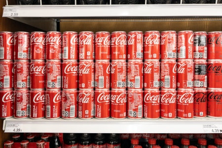 Novi, Michigan, USA - Sep 22, 2022 : Coca-cola in cans on row display for sale in the supermarket shelvesのeditorial素材