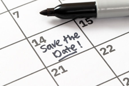 Save the day reminder written on calendar in black markerの写真素材
