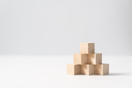Pyramid of six wooden cubes, on white background for business progressing concept