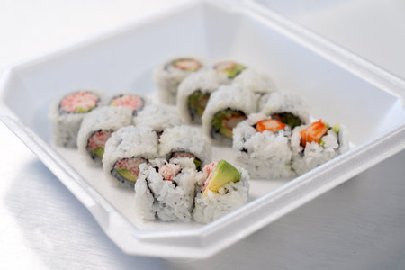 Two California sushi rolls in the take away containerの写真素材